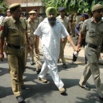 Police_Person_Taking_Out_Paramjit_Singh_After_Producing_District_Court_on_Wednesday_Morning.sm