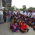 Baldev Singh Sandhu and other staff with girls appearing in the test.sm