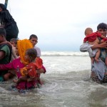 On 7 September 2017, newly arrived Rohingya refugees walk ashore