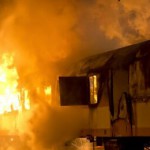 fire fighter extinguishing burning train